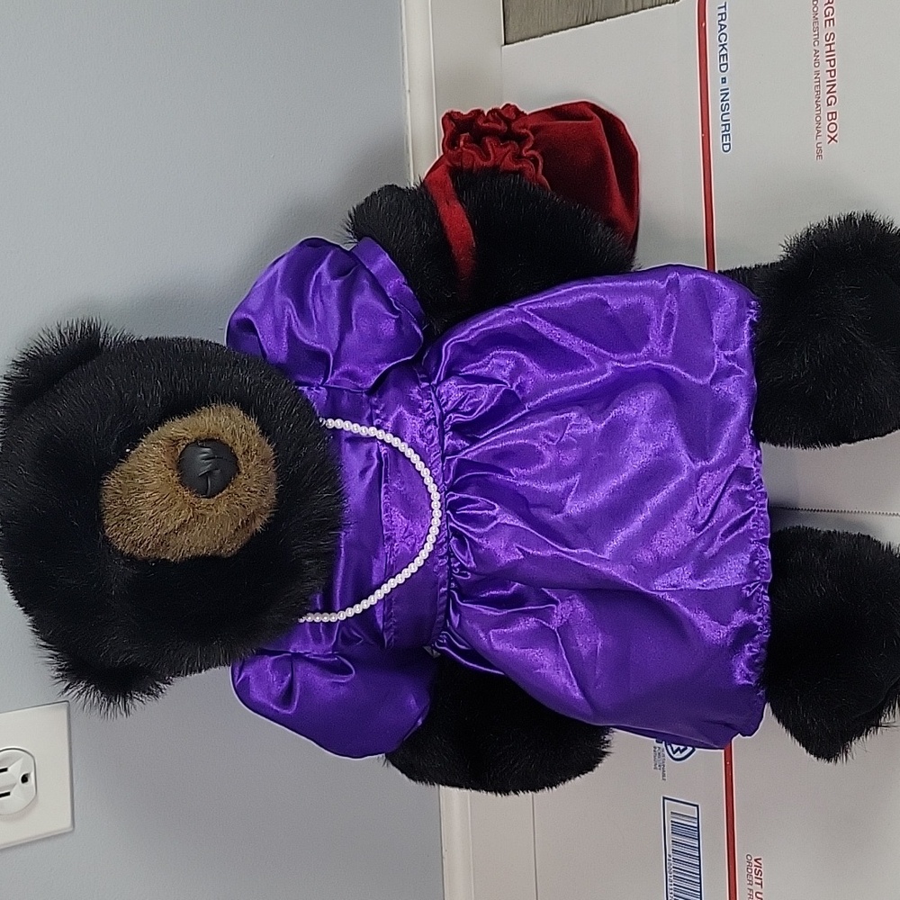 Bronner's Ditz Design Plush Bear wearing pearls and purple dress